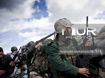 Members of the Kurdish Peshmerga forces, PKK and YPG fighting for retaking the Sinjar City from ISIS, on March 23, 2015. (