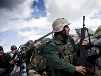 Members of the Kurdish Peshmerga forces, PKK and YPG fighting for retaking the Sinjar City from ISIS, on March 23, 2015. (