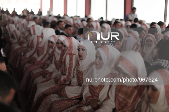 Palestinians during a mass wedding ceremony in Gaza City, on April 11, 2015. Nearly 200 Palestinian couples were married in a ceremony funde...