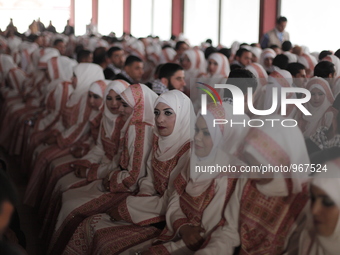 Palestinians during a mass wedding ceremony in Gaza City, on April 11, 2015. Nearly 200 Palestinian couples were married in a ceremony funde...