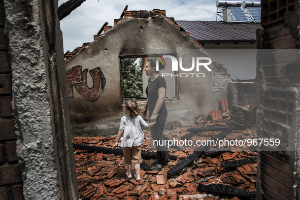 KUMANOVO, KOSOVO-- May 27, 2015- Zerije Asana and her niece Blina, 4, inside her family's destroyed home in Kumanovo, Macedonia.  The family...