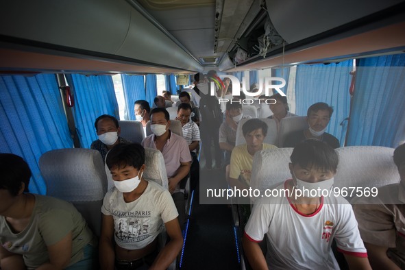 Refugees seen wearing face masks in order to protect themselves from the toxic air which has been confirmed by the Chinese authority as they...