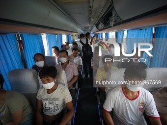 Refugees seen wearing face masks in order to protect themselves from the toxic air which has been confirmed by the Chinese authority as they...