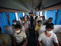 Refugees seen wearing face masks in order to protect themselves from the toxic air which has been confirmed by the Chinese authority as they...