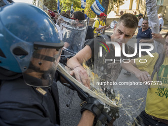 Demonstrators Clash with riot police following a demonstration, organized by antagonist to protest against the visits of Italian PM Matteo R...