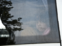 A girl looks out of a window in Edirne, Turkey on September 22, 2015. The European Union approves a plan to share 120,000 refugees across it...