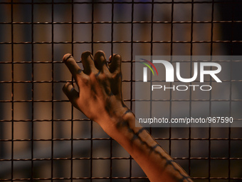 A migrant awaiting to enter to the transfer camp in Opatovac near the border crossing point between Serbia and Croatia, on September 22, 201...