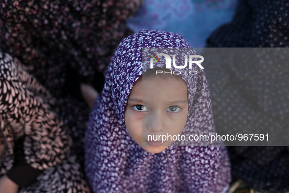 A Muslim Palestinian girl attends Eild al-Adha prayers on Sept. 24, 2015. in Gaza City. Eid al-Adha or Feast of the Sacrifice, marks the end...