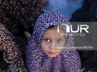 A Muslim Palestinian girl attends Eild al-Adha prayers on Sept. 24, 2015. in Gaza City. Eid al-Adha or Feast of the Sacrifice, marks the end...