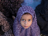 A Muslim Palestinian girl attends Eild al-Adha prayers on Sept. 24, 2015. in Gaza City. Eid al-Adha or Feast of the Sacrifice, marks the end...