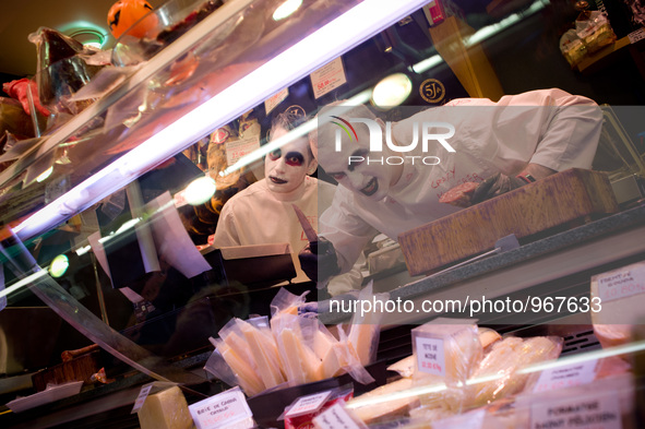 Vendors dressed in their Halloween costumes  pose for a photo at Santa Caterina Market in Barcelona, Spain on 31 October, 2015. 