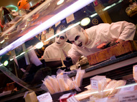 Vendors dressed in their Halloween costumes  pose for a photo at Santa Caterina Market in Barcelona, Spain on 31 October, 2015. (