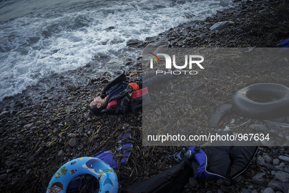 A boy lies dead on the shore of Skala Sikamineas after the sea washed him out. Lesbos, November 1, 2015. 