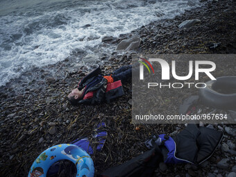 A boy lies dead on the shore of Skala Sikamineas after the sea washed him out. Lesbos, November 1, 2015. (