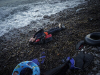 A boy lies dead on the shore of Skala Sikamineas after the sea washed him out. Lesbos, November 1, 2015. (