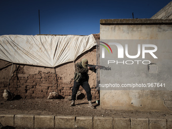 Free Syrian Army take position during clashes with regime forces in the countryside south of Aleppo in northern Syria on Novamber 14,2015. (