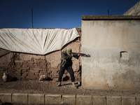 Free Syrian Army take position during clashes with regime forces in the countryside south of Aleppo in northern Syria on Novamber 14,2015. (