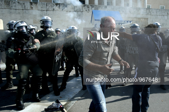 Clashes between riot police and farmers in Syntagma square outside the Greek Parliament after a protest march against austerity and taxation...