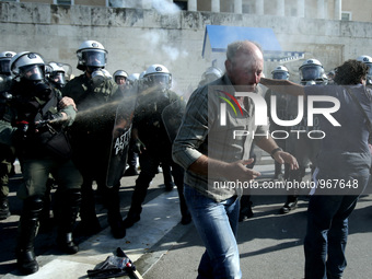 Clashes between riot police and farmers in Syntagma square outside the Greek Parliament after a protest march against austerity and taxation...