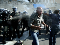 Clashes between riot police and farmers in Syntagma square outside the Greek Parliament after a protest march against austerity and taxation...