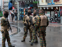 Soldiers and police officers in Brussels, on November 21, 2015. Brussels will remain at the highest possible alert level today, with schools...