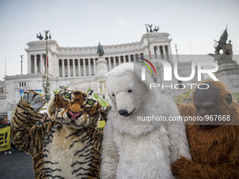 Demonstrators march during a rally calling for action on climate change on November 29, 2015 in Rome a day before the launch of the COP21 co...