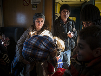 Immigrants from Afghanistan, Syria and Iraq boarded crowded trains from the southern Macedonian border towards the Serbian border, on Novemb...