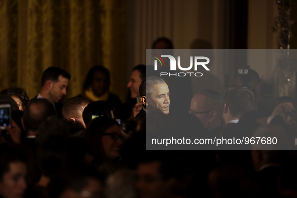 United States President Barack Obama shakes hands at the end of a Hanukkah reception in the East room of the White House, in Washington, DC,...