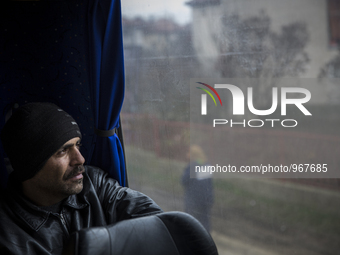 Dimitrovgrad, Serbia-- December 16, 2015--Muhammed Wais Pazhwak, 35, waiting inside the Belgrade bound bus parked outside the police registr...