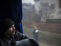 Dimitrovgrad, Serbia-- December 16, 2015--Muhammed Wais Pazhwak, 35, waiting inside the Belgrade bound bus parked outside the police registr...