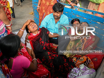 

Relatives of a child are reacting to the death of the child, who was suffering from respiratory problems, at a hospital in Kolkata, India,...