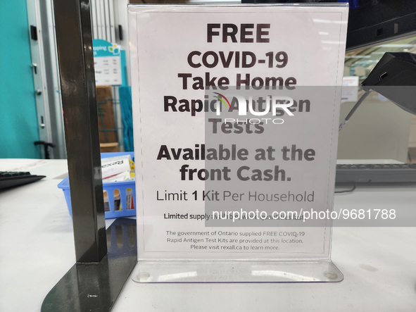 Sign at a pharmacy informing customers that free COVID-19 Rapid Antigen test kits are available in Toronto, Ontario, Canada on February 22,...