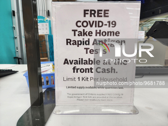 Sign at a pharmacy informing customers that free COVID-19 Rapid Antigen test kits are available in Toronto, Ontario, Canada on February 22,...