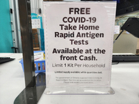 Sign at a pharmacy informing customers that free COVID-19 Rapid Antigen test kits are available in Toronto, Ontario, Canada on February 22,...