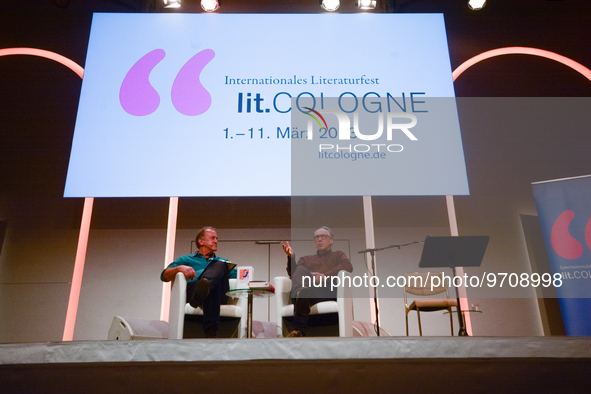 Bernhard Robben, a German literary moderator, speaks to Ian McEwan, an English novelist on the stage at Flora Hall during the Lit.cologne, t...