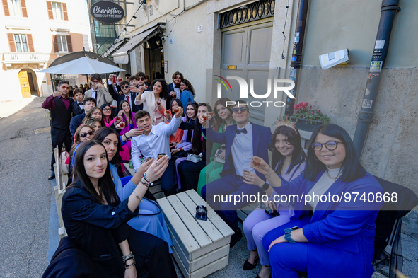 Students celebrate 100 days to the high-school leaving exams amid toasts and a mega-lunch in Rieti, Italy, on 13 March 2023.  