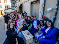 Students celebrate 100 days to the high-school leaving exams amid toasts and a mega-lunch in Rieti, Italy, on 13 March 2023.  (