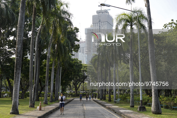 People running amid heavy air pollution of fine particulate matter (PM2.5) shrouds at Lumpini Park in Bangkok, Thailand, 14 March 2023. Seve...