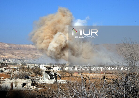 (151224) -- DAMASCUS, Dec. 24, 2015 () -- Photo taken on Dec. 24, 2015 shows smoke from an explosion site in the rebel-held suburb of Daraya...