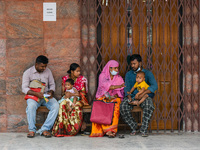 Families are seen outside a fever clinic of a hospital in Kolkata , India , on 16 march 2023 . Cases of respiratory distress in children's s...