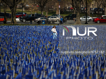 A young girl walks through a visual exhibit of flags organized by the Fight Colorectal Cancer organization on the National Mall in Washingto...