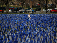 A young girl walks through a visual exhibit of flags organized by the Fight Colorectal Cancer organization on the National Mall in Washingto...