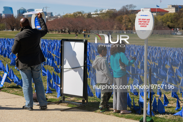 People view a visual exhibit organized by the Fight Colorectal Cancer organization on the National Mall in Washington, D.C. on March 16, 202...