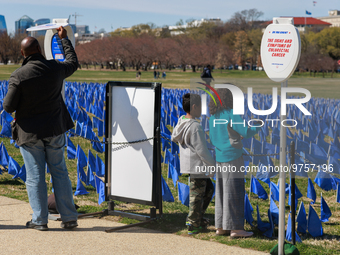 People view a visual exhibit organized by the Fight Colorectal Cancer organization on the National Mall in Washington, D.C. on March 16, 202...