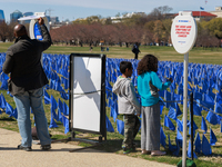 People view a visual exhibit organized by the Fight Colorectal Cancer organization on the National Mall in Washington, D.C. on March 16, 202...