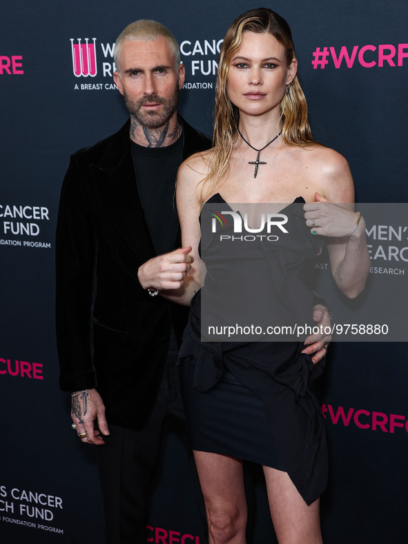 American singer and songwriter Adam Levine of American pop rock band Maroon 5 and wife/Namibian model Behati Prinsloo arrive at The Women's...