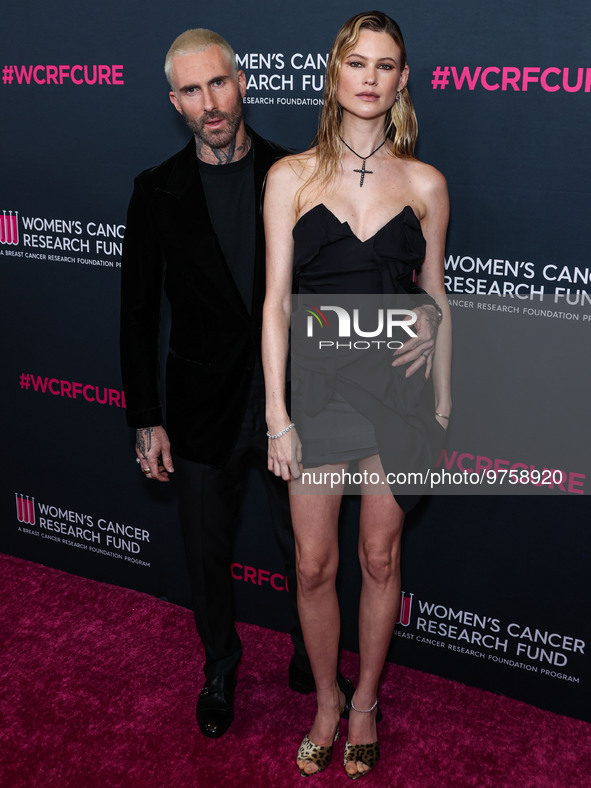 American singer and songwriter Adam Levine of American pop rock band Maroon 5 and wife/Namibian model Behati Prinsloo arrive at The Women's...