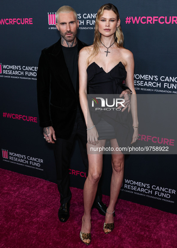 American singer and songwriter Adam Levine of American pop rock band Maroon 5 and wife/Namibian model Behati Prinsloo arrive at The Women's...