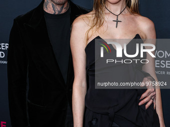 American singer and songwriter Adam Levine of American pop rock band Maroon 5 and wife/Namibian model Behati Prinsloo arrive at The Women's...