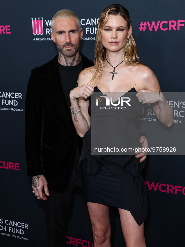 American singer and songwriter Adam Levine of American pop rock band Maroon 5 and wife/Namibian model Behati Prinsloo arrive at The Women's...